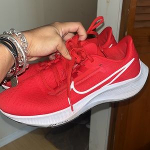 Nike red running shoes